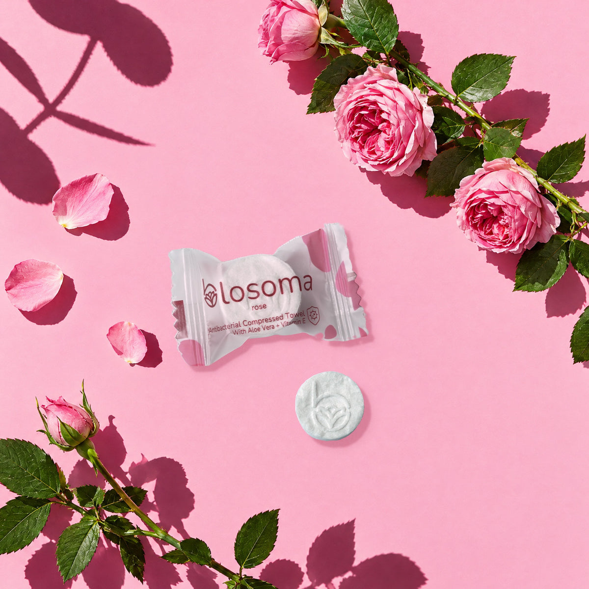 Wrapped rose antibacterial compressed towel and tablet with roses