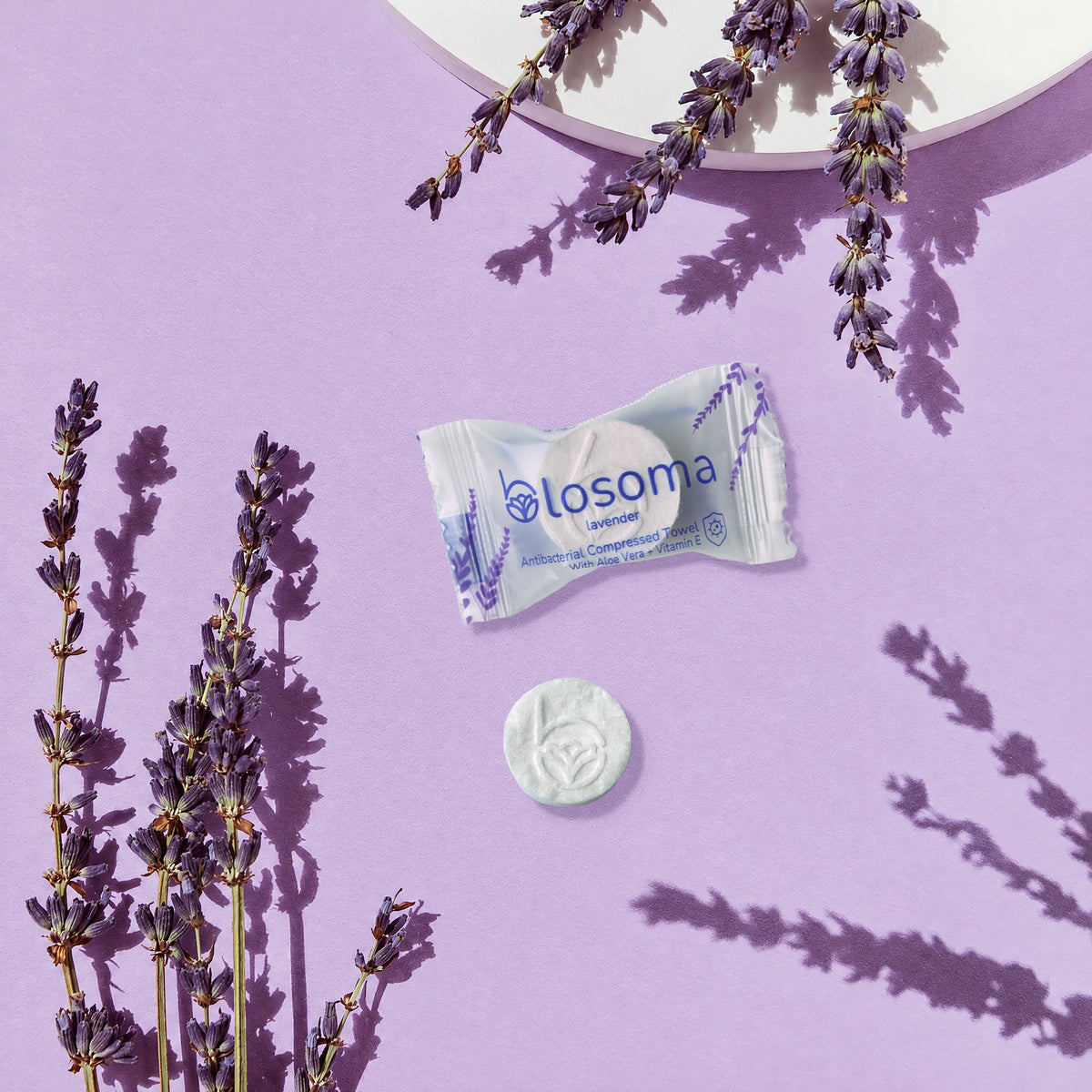Wrapped lavender antibacterial compressed towel and tablet