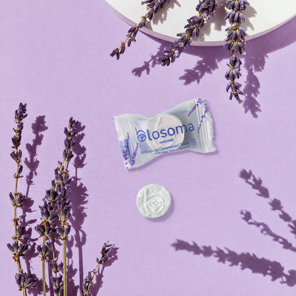 Wrapped lavender antibacterial compressed towel and tablet
